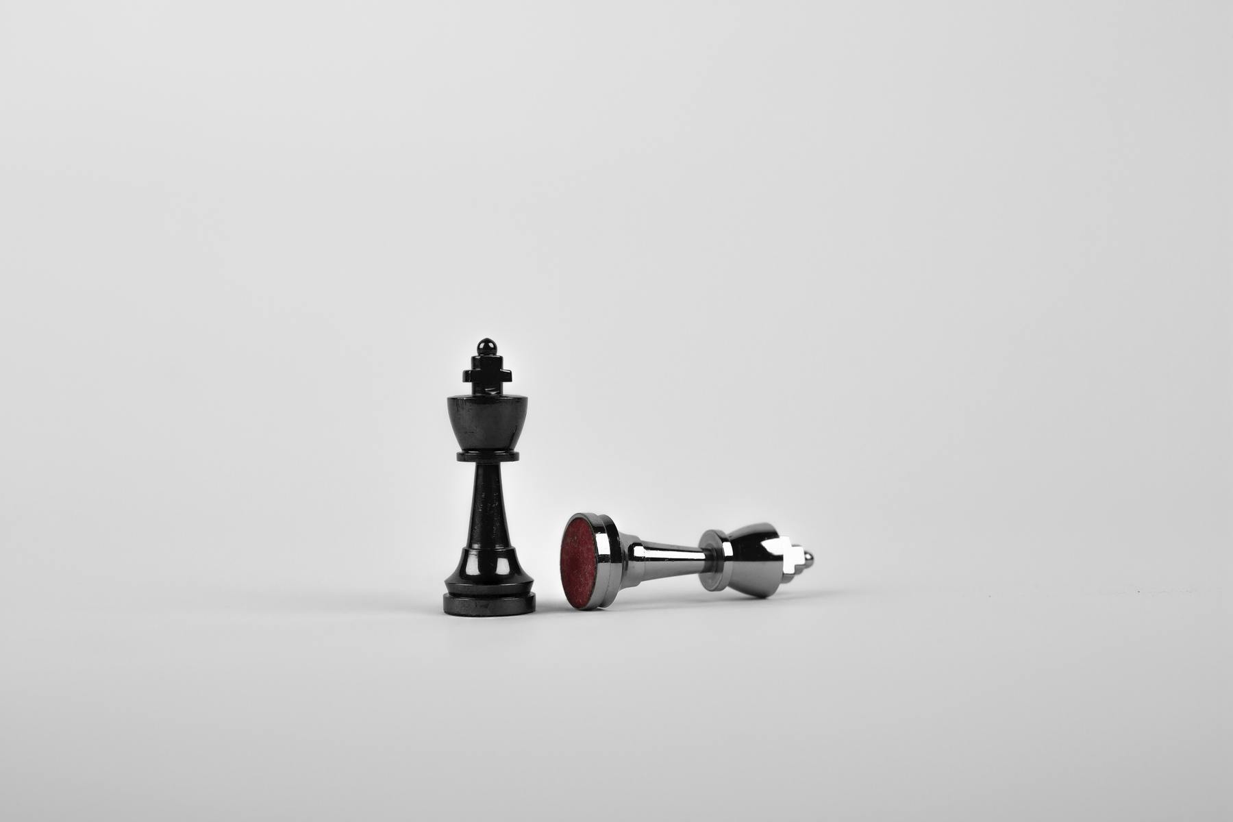 Two chess pieces on a blank white background, showing how culture eats strategy for breakfast.