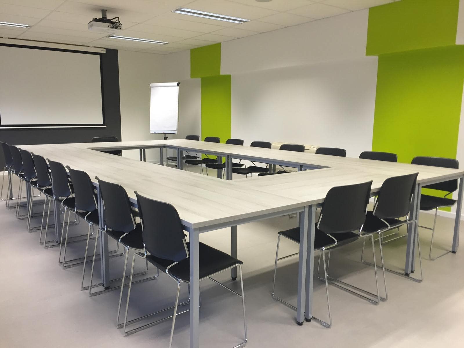 An empty conference room exemplifies the cost of useless meetings