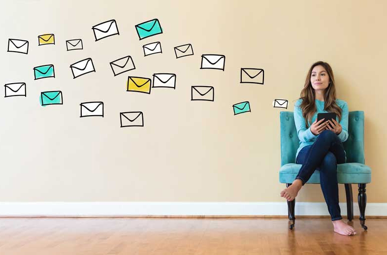 A woman sitting in a blue chair with line drawn envelopes floating above her, demonstrating how a stakeholder interview is designed to provide new perspectives.