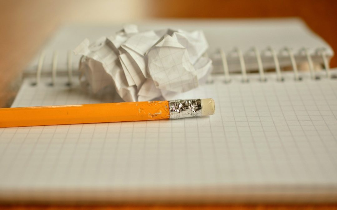A pencil and a crumpled piece of notebook paper, representing three toxic leadership habits we should relegate to the dustbin.