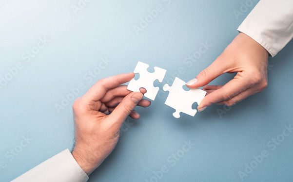 Two puzzle pieces slotting together, showing the need to put the pieces together to create a healthy workplace.